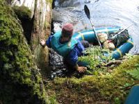 Exiting a packraft on the Kenai