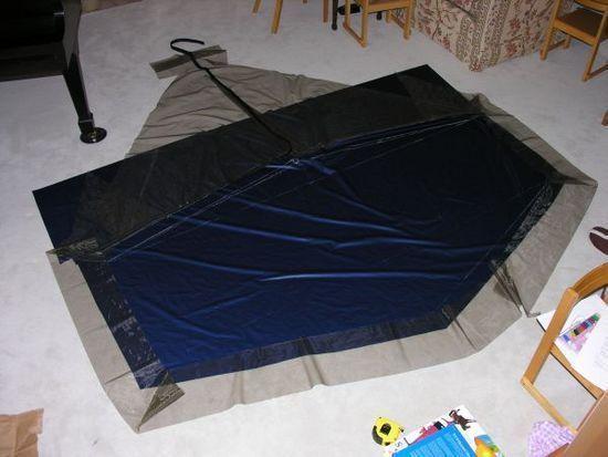 Layup of groundsheet, netting, door and zippers