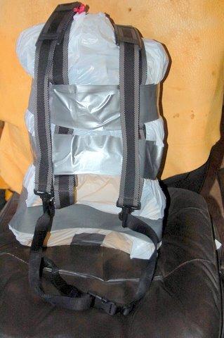 Garbage bag pack filled back side w/ harness and waist belt