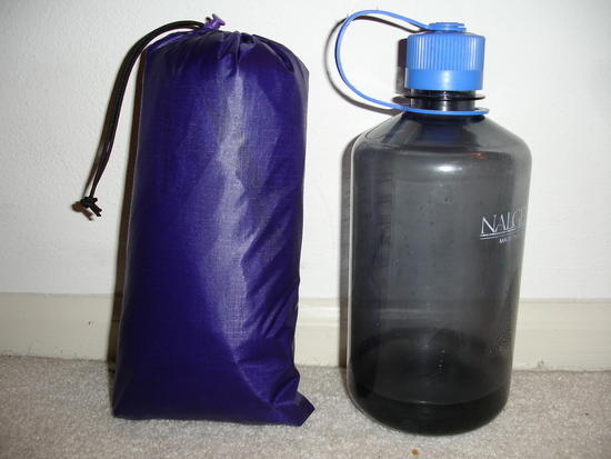 stuffed bivy next to water bottle