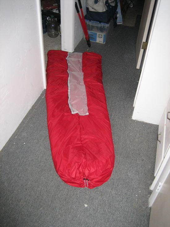Quilt velcroed up to become a sleeping bag and the drawcord tightened to close the footbox