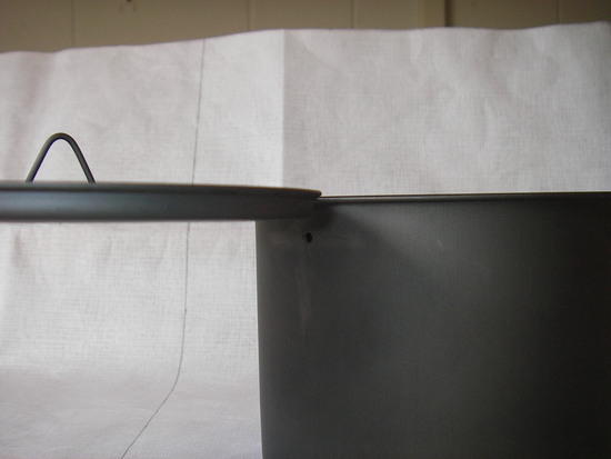 Punch hole allowing for depth of lid.