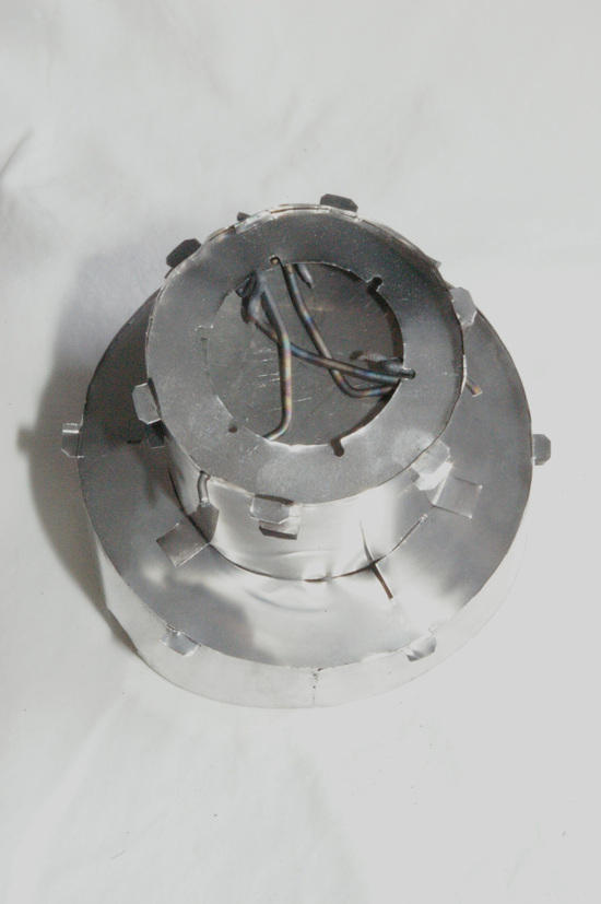 bottom view, legs retracted into base