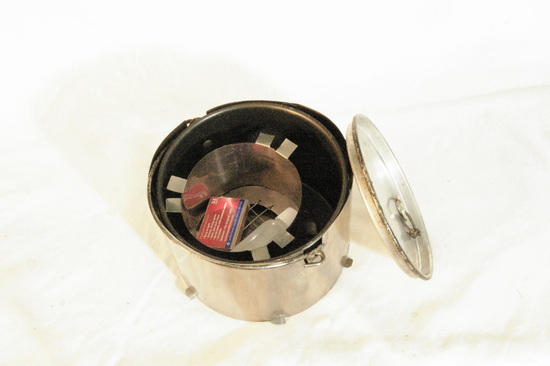 stove packed with pot matches and tinder