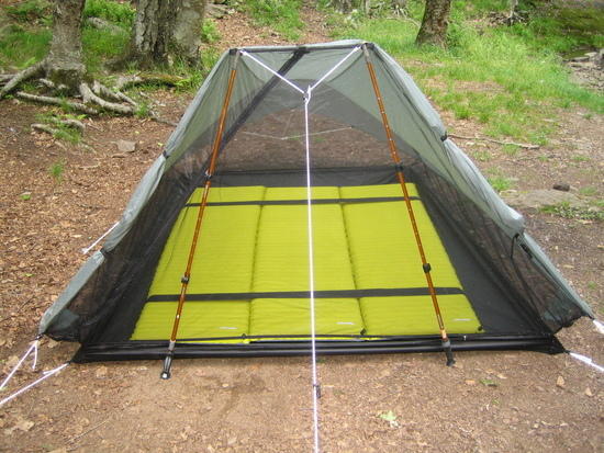 Pads strapped together inside a Rainshadow Tarptent