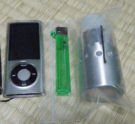 Side B against a ligher and iPod NANO