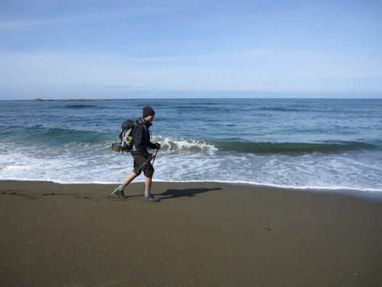 Marc plodding along the shore