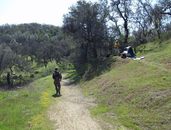 Mountain Biker, Backpacker on the Side of the Trail