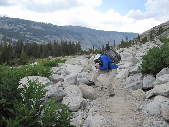 Jeremy Working the Compass to Find Position on the Trail