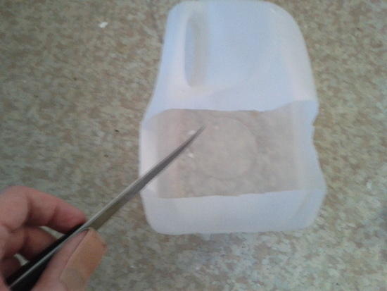 Cut out a strip from the jug.