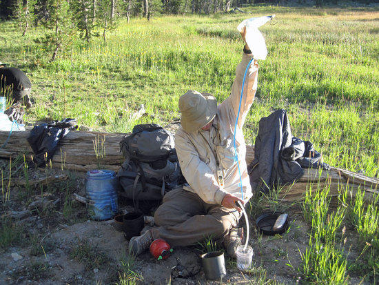 Scott Filtering Water with his Sawyer Inline filter