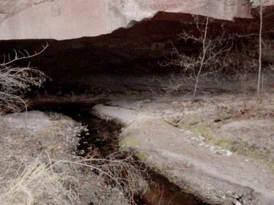 Eroded below cliff