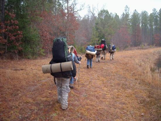 The boys head out with loaded packs