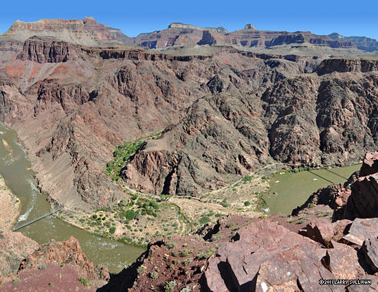 From a lookout point, a nice view of the bend where green Bright Angel canyon joins the Colorado River.