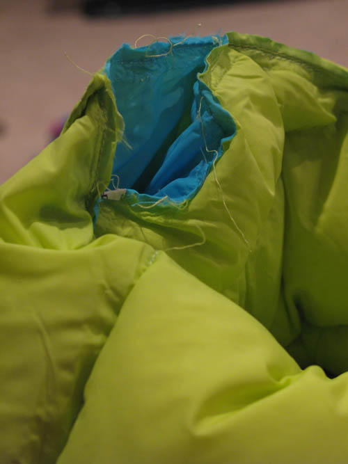 Sample showing different colored thread holding sleeves and vest together
