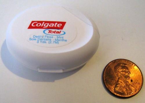 Tiny dental floss container