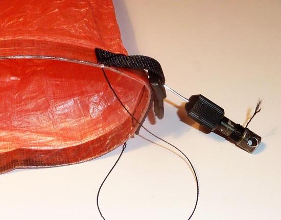 Webbing with buckle being sewn to Dry Bag
