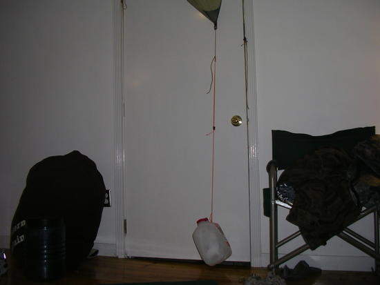 two milk jugs full of water, about 16 lbs, suspended by a corner pullout on MLD Cuben Patrol