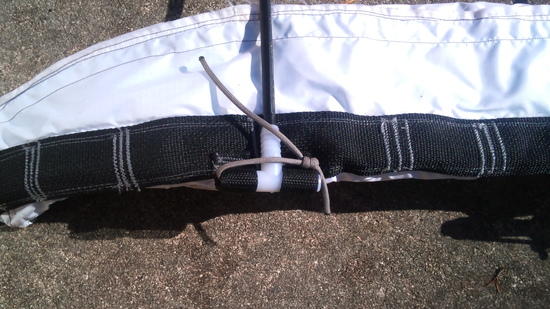 A close-up of the frame attachment point at the waist belt.