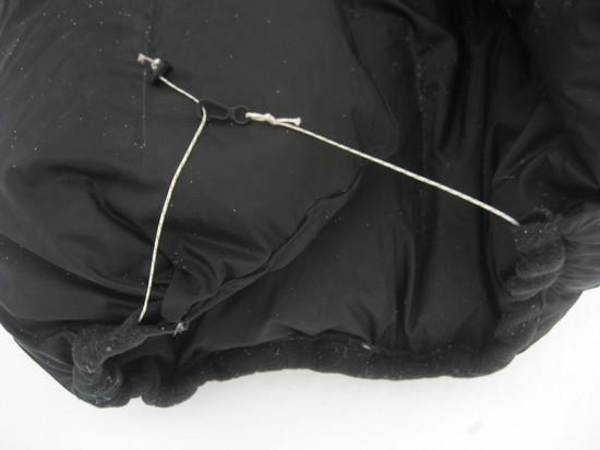 Detail of neck closure and fleece drawcord channel.