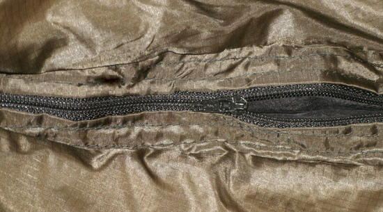 The sewing arounf the zipper is a little sloppy but its secure and functional. I can live with it
