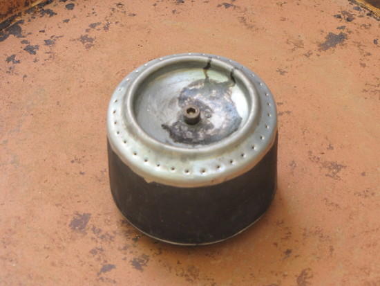 Pressure jet stove with spring loaded fill port.