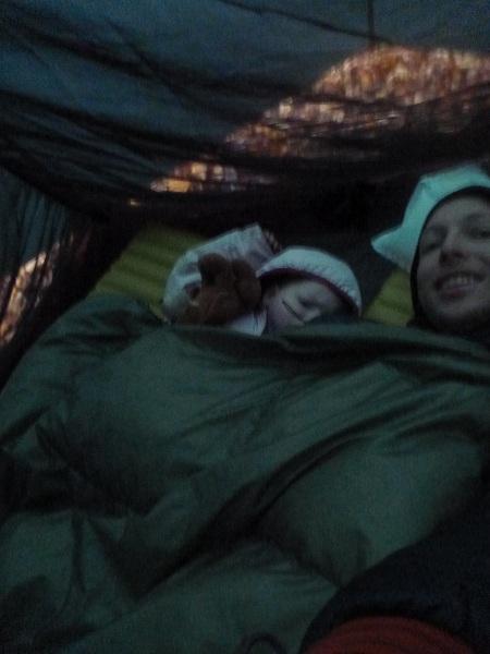Dad and toddler under one quilt