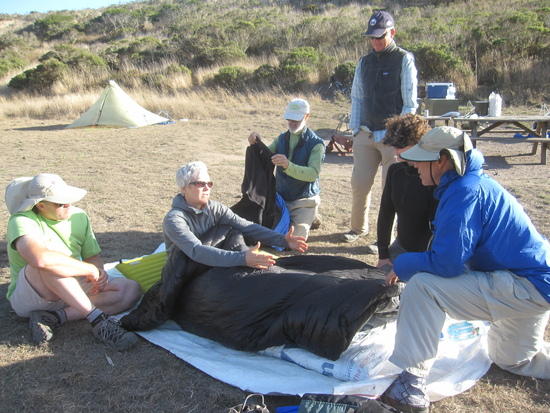 Amy Demonstrating her Quilt wtih Wide Footbox to Two People