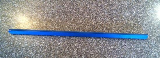 Report cover retaining strip