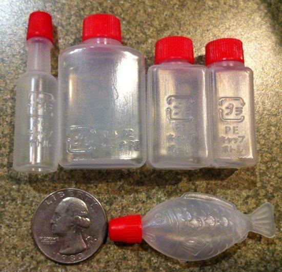 Small bottles.  The largest holds 1/2 oz and weighs .09 oz empty.