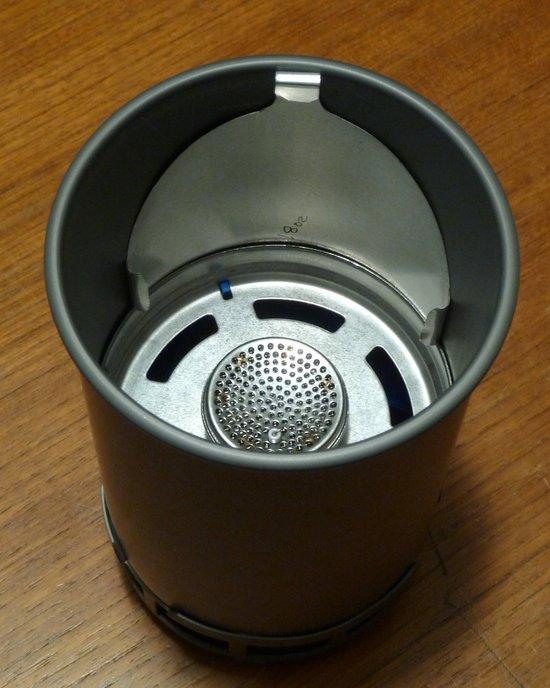 Lid stowed inside pot with burner