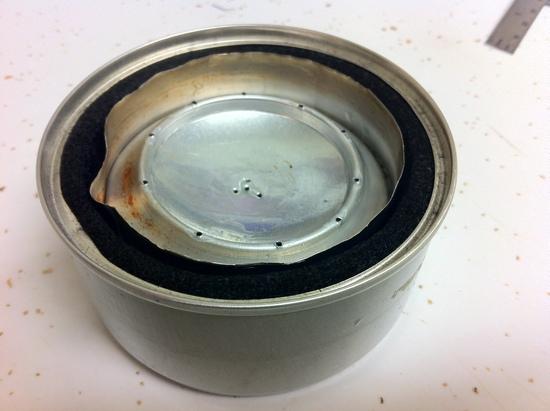 Insulated base for penny can stove