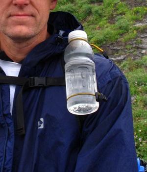 Bottle holster on shoulder strap