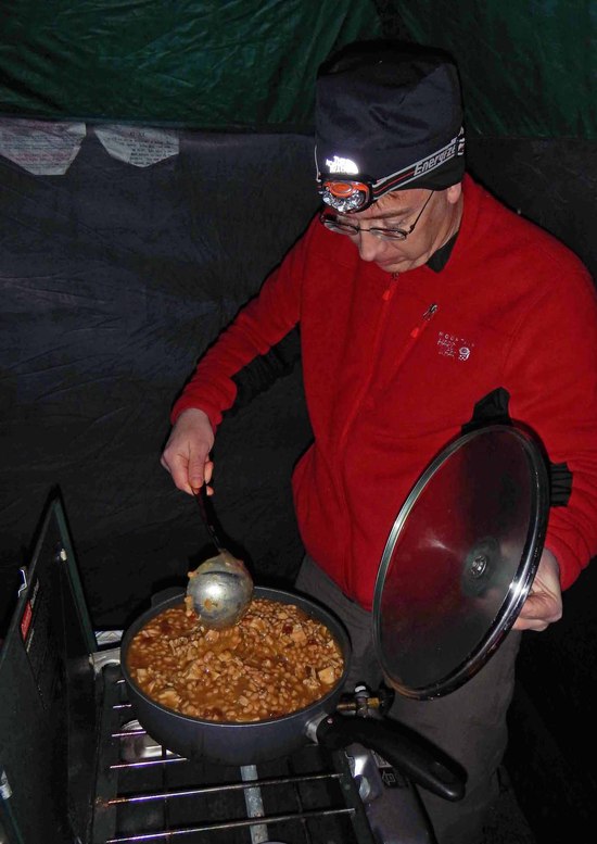 Ed stirs the chili