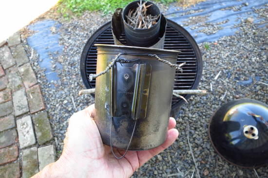750 pot will hang in stove from side or via rotating handle wires from above