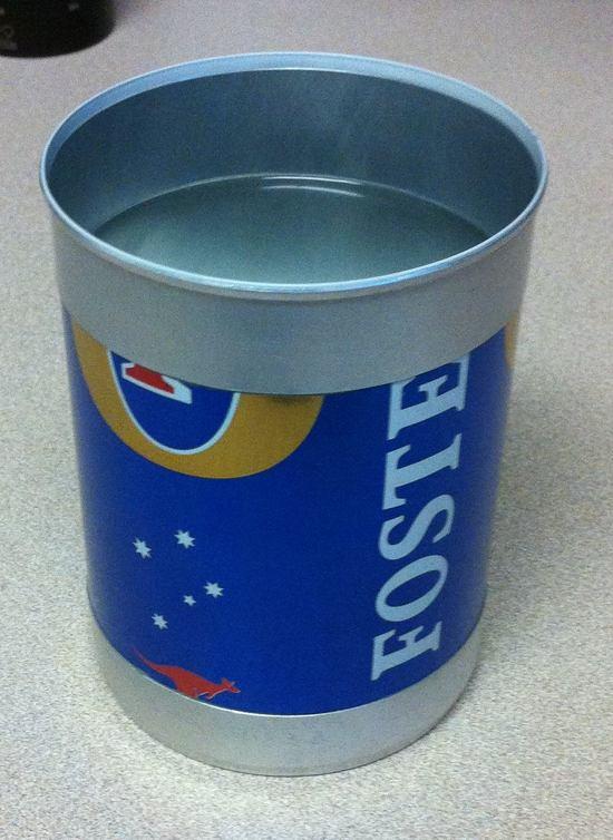 Foster's can with cat food top